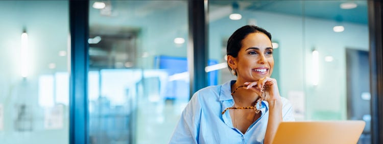 A woman confidently and happily looking towards the future
